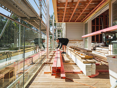 Builder working on a wooden frame